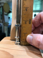 Measuring for correct fitment of main lamp pipe, on top of base.