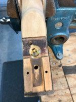 Threaded brass insert is where switch will be mounted from front of fingerboard.