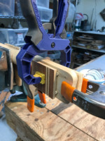 Gluing and clamping plugs in back of Peg head, to fill tuning machine holes.