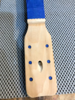 Peg head and fingerboard masked and ready for painting.